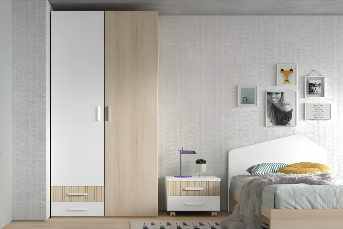 armario de dos puertas batientes colocado al lado de una mesita de noche y una cama en una habitación juvenil.